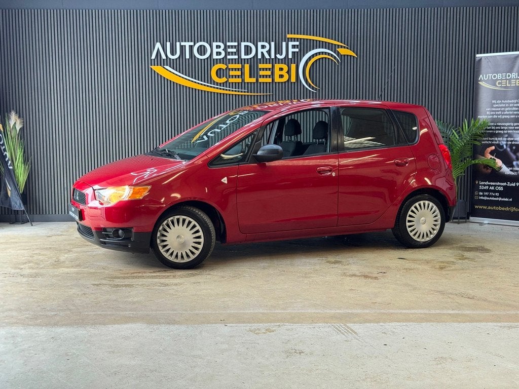 Mitsubishi Colt 1.1 Edition One 2010 ROOD APK|NAP|AIRCO, Auto's, Mitsubishi, Euro 5, Stof, Gebruikt, Metallic lak