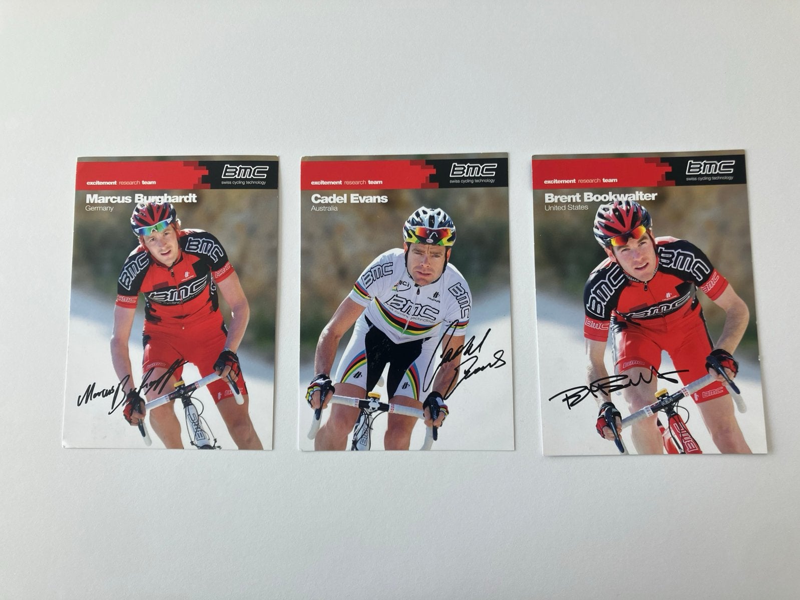 3x gesigneerd Cadel Evans Brent Bookwalter, Marcus Burghardt, Ophalen of Verzenden, Zo goed als nieuw, Overige typen