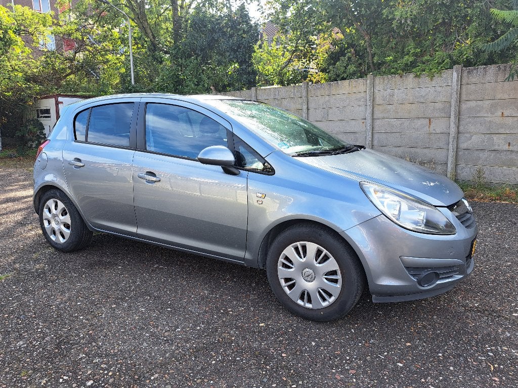 Opel Corsa 1.2 Twinport 85pk 5d 2010 Grijs nw apk, Auto's, Voorwielaandrijving, Stof, 4 cilinders, 1229 cc