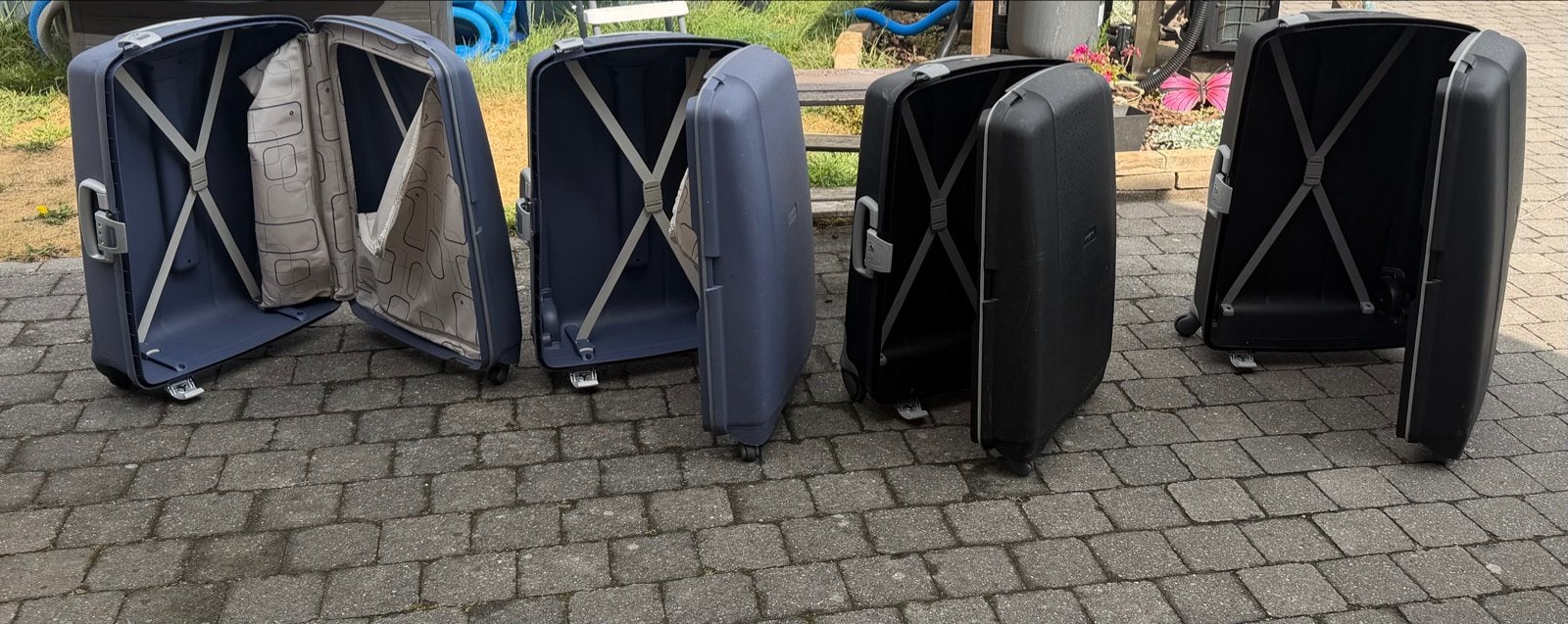 Samsonite koffers - 2 blauw, 2 zwart - met 4 wieltjes, Gebruikt, Hard kunststof, 35 tot 45 cm, Uitschuifbare handgreep