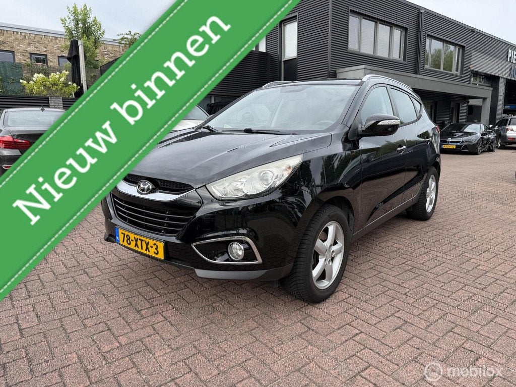Hyundai ix35 2.0i Business Edition Automaat Navi Camera Nap, Auto's, Hyundai, Gebruikt, Zwart, 4 cilinders, Leder en Stof