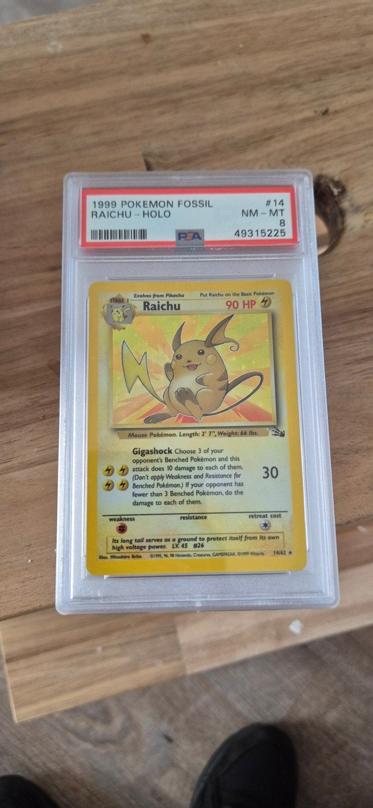 PSA 8 1999 Pokémon Fossil Raichu Holo #14, Ophalen of Verzenden, Zo goed als nieuw, Losse kaart, Foil