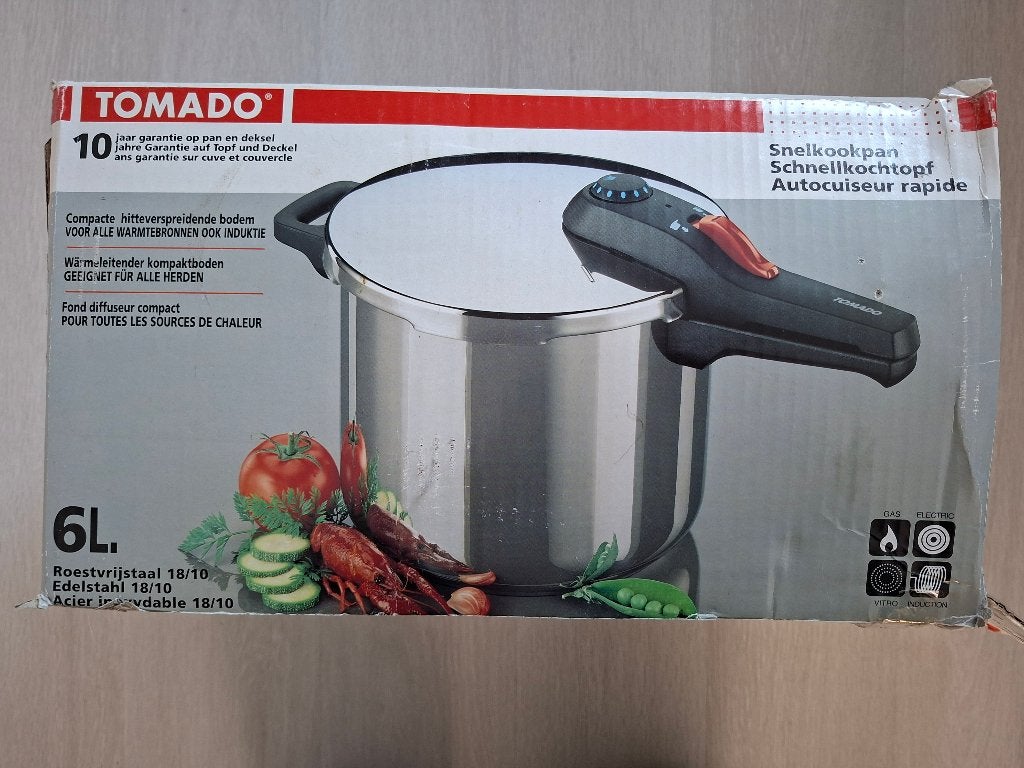 6 liter Tomado snelkookpan incl. accessoires en handleiding, Ophalen, Snelkookpan, Gebruikt, Gietijzer