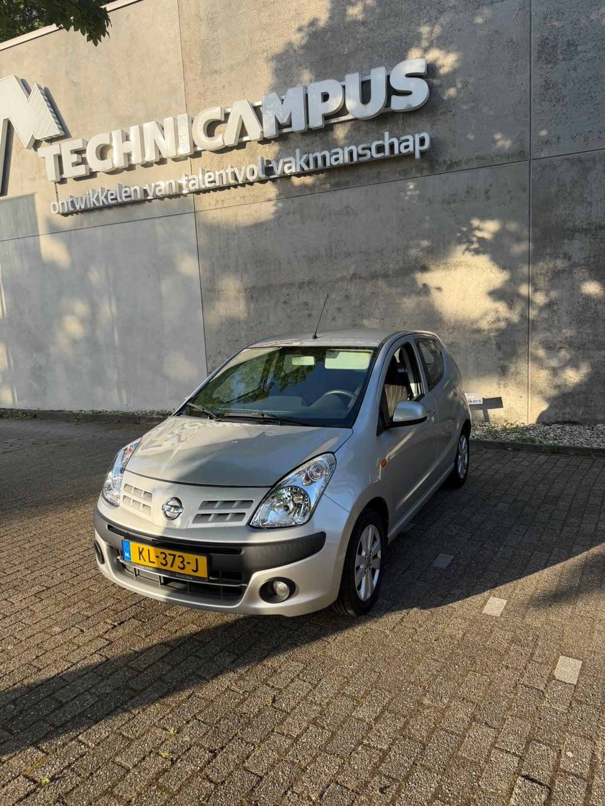 Nissan Pixo 1.0 50KW 5D 2013 Grijs airco, Voorwielaandrijving, Stof, 4 stoelen, Handgeschakeld