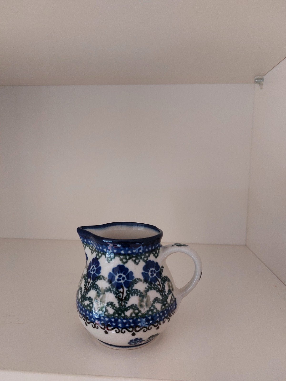 Melkkannetje van Bunzlau aardewerk, Ophalen