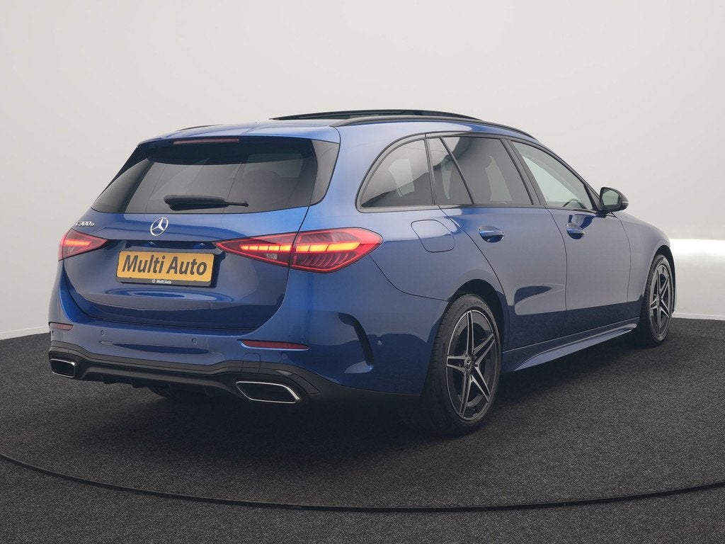 Mercedes-Benz C-Klasse Estate 300 e 4MATIC AMG Line PHEV 313, Auto's, Mercedes-Benz, Automaat, 4 cilinders, Blauw, Plug-in hybride