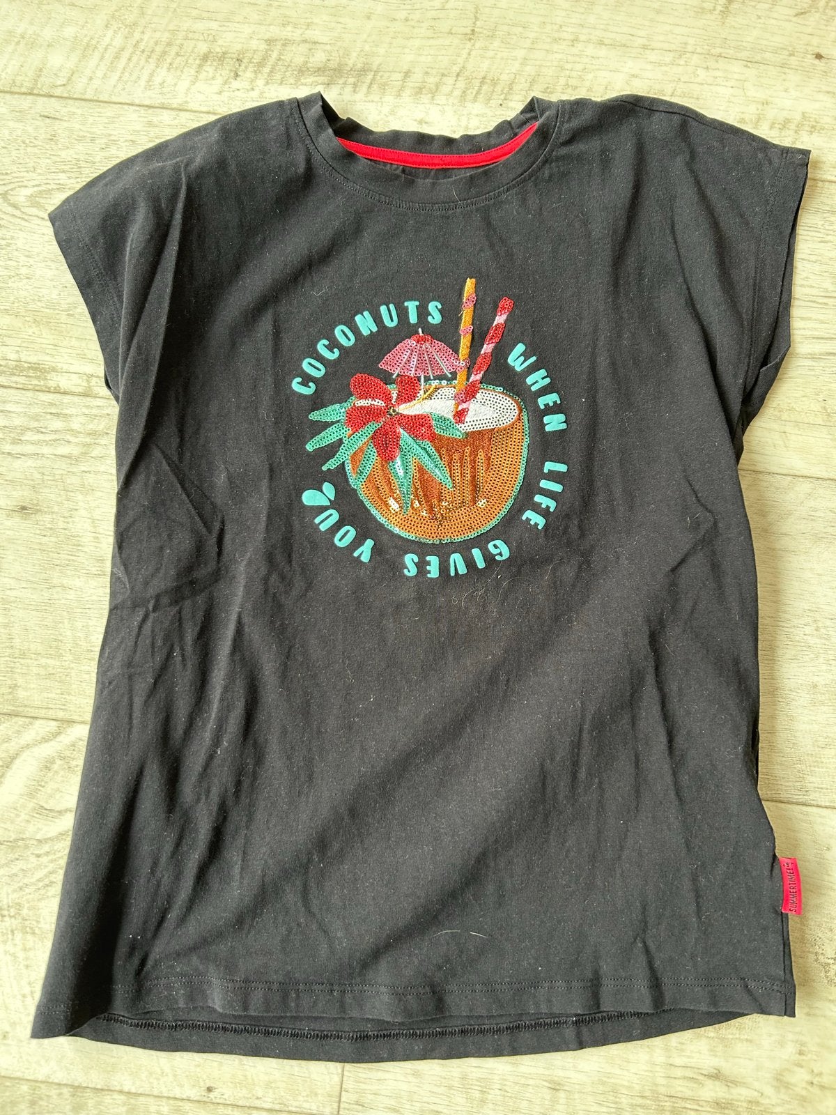 Zwart T-shirt met pailletten kokosnoot print - WE, Ophalen, Gebruikt, Meisje, Shirt of Longsleeve