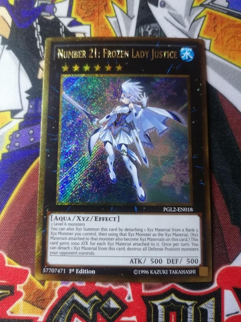 Number 21 Frozen Lady Justice - Gold Secret Rare PGL2 - YGO, Ophalen of Verzenden, Zo goed als nieuw, Foil