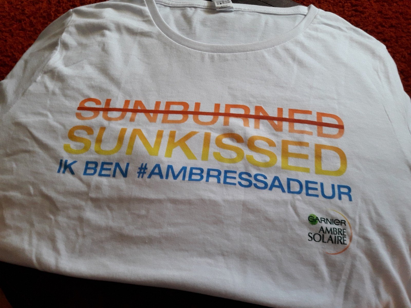 Nieuw wit T-shirts van Ambre Solaire., Verzamelen, Ophalen of Verzenden, Nieuw, Gebruiksvoorwerp