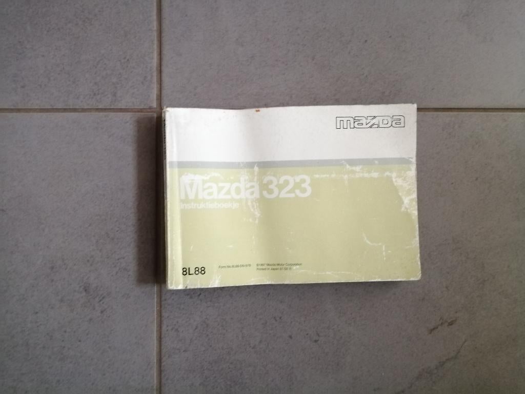 Gebruikershandleiding MAZDA 323 coupe (3drs)  1994/1999, Ophalen of Verzenden