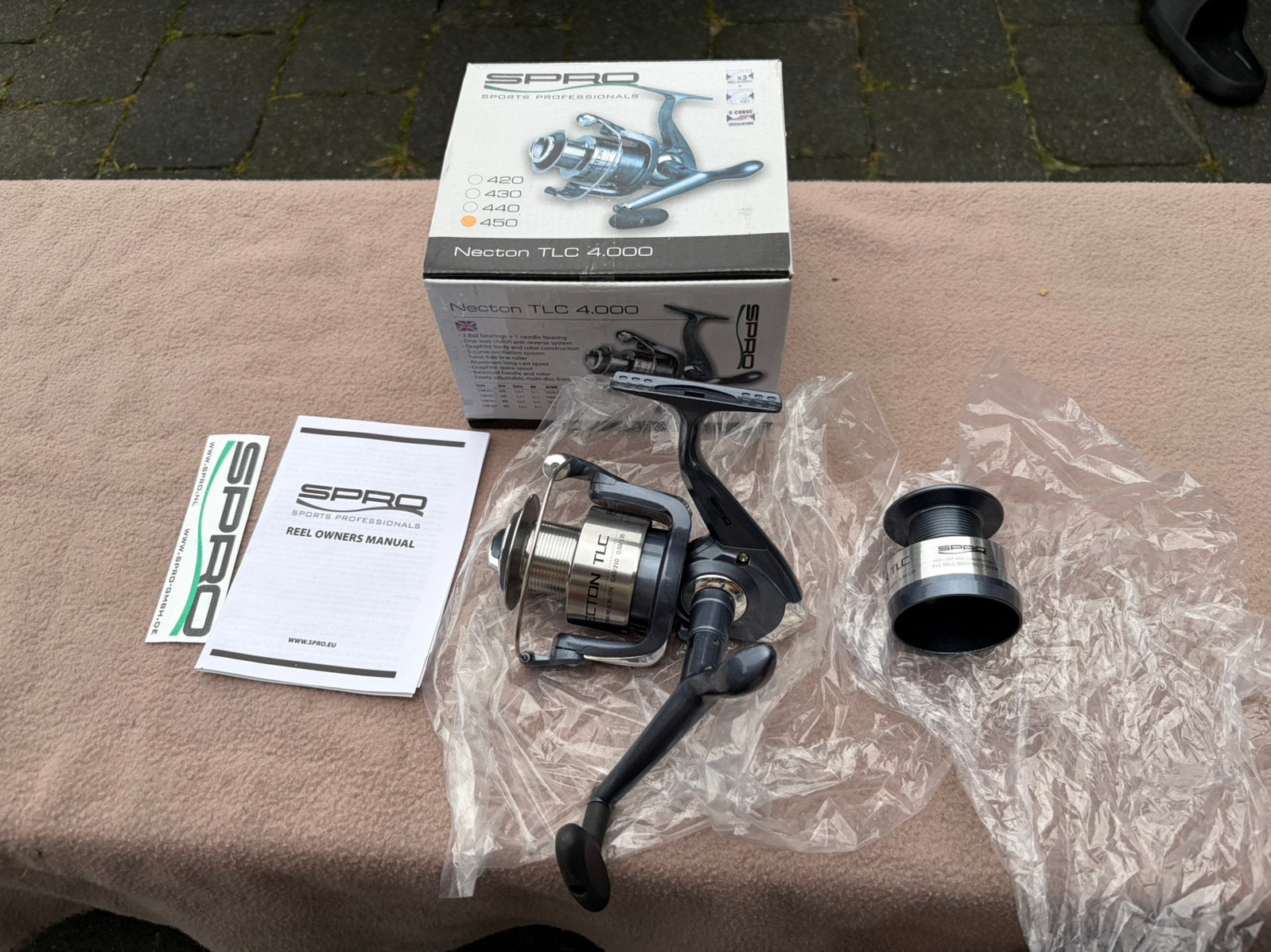 Nieuwe spro necton tlc 4000 molen incl spoel, Ophalen of Verzenden, Nieuw, Molen