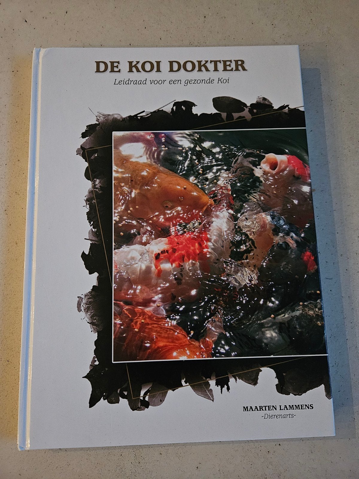 De koi dokter - Maarten Lammens, Ophalen of Verzenden, Zo goed als nieuw, Interieur en Design