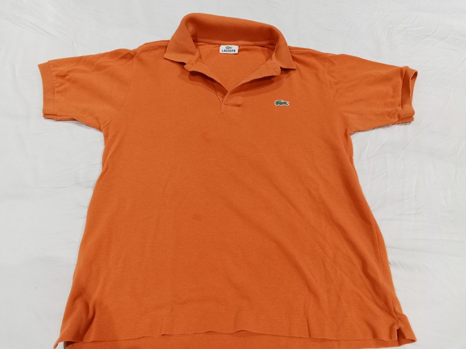 Lacoste polo oranje maat l
Valt ietsjes kleiner, Maat 52/54 (L), Lacoste, Oranje, Ophalen of Verzenden