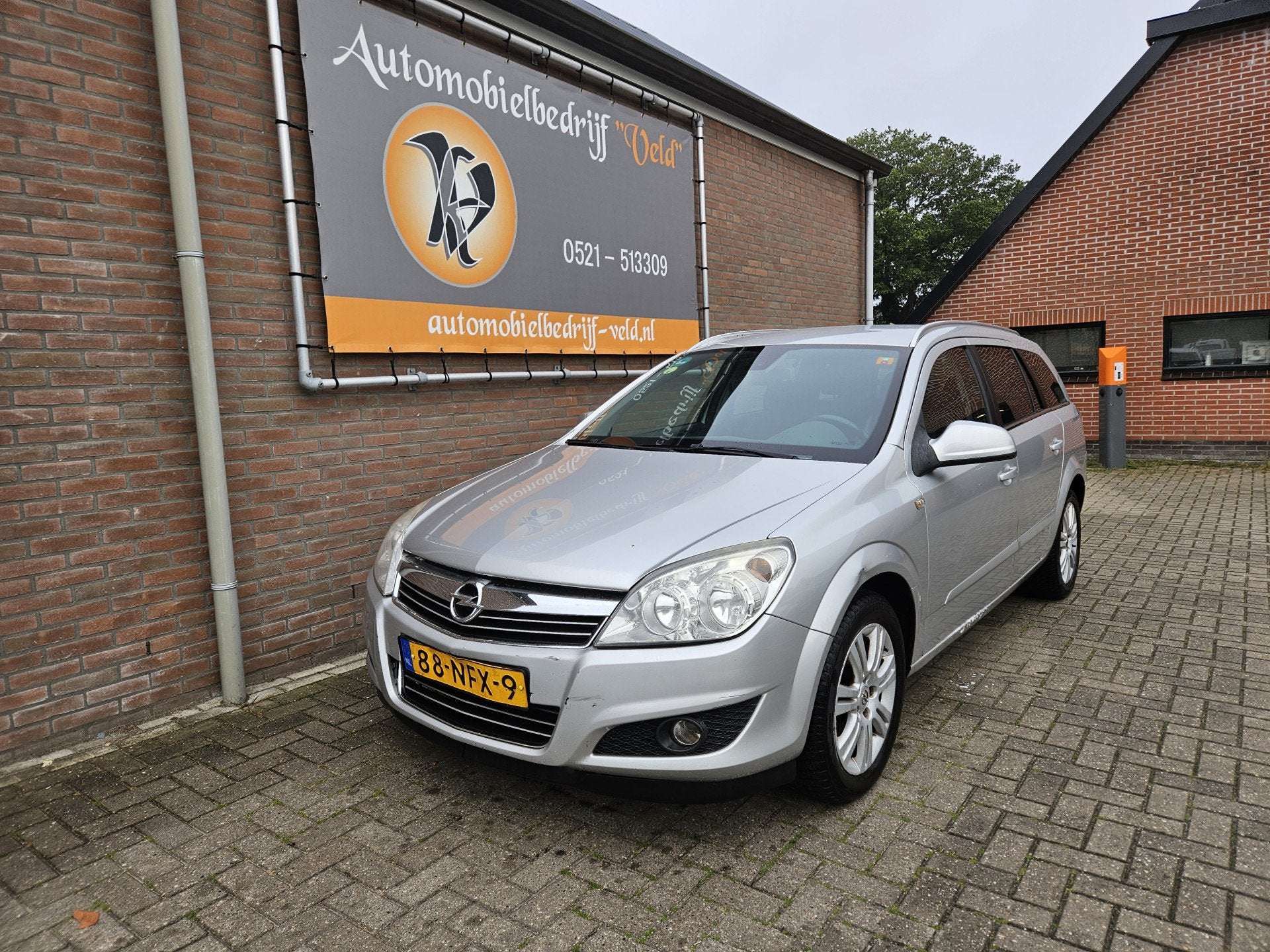 Opel Astra Wagon 1.6 Cosmo (bj 2010), Auto's, Voorwielaandrijving, 15 km/l, Gebruikt, Zwart