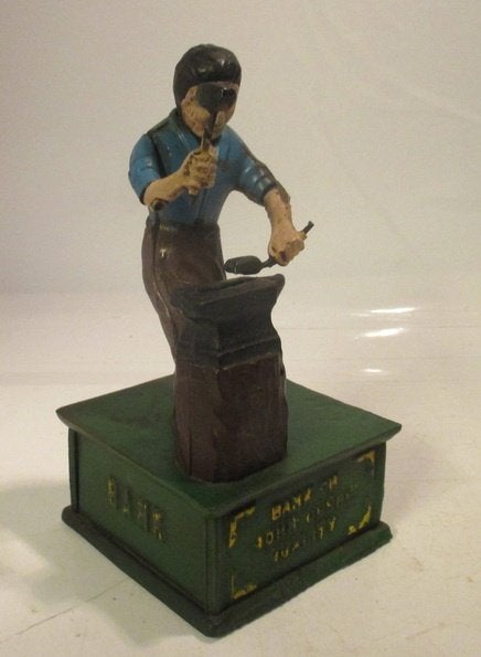 vintage gietijzeren mechanische spaarpot met een smid, Verzenden