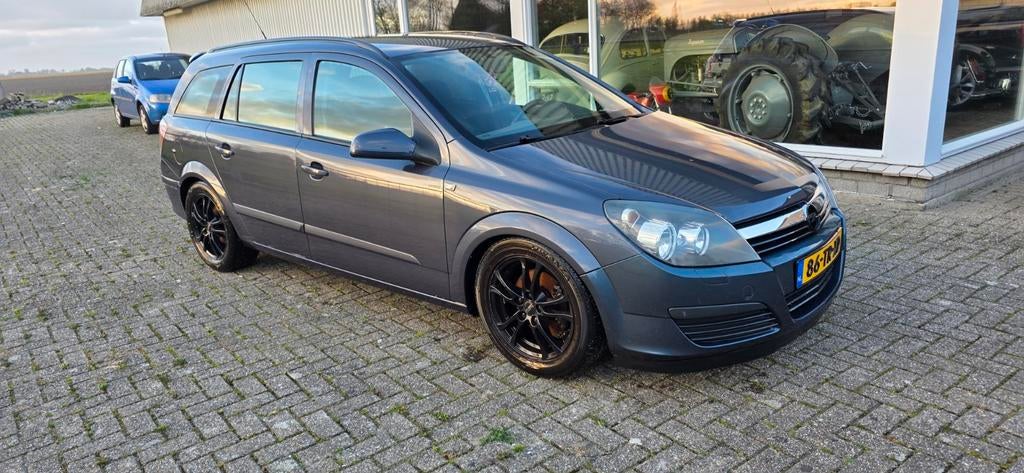 Opel Astra 1.6 16V St.wgn. 2007 Grijs, Auto's, Opel, Voorwielaandrijving, 15 km/l, 4 cilinders, Origineel Nederlands
