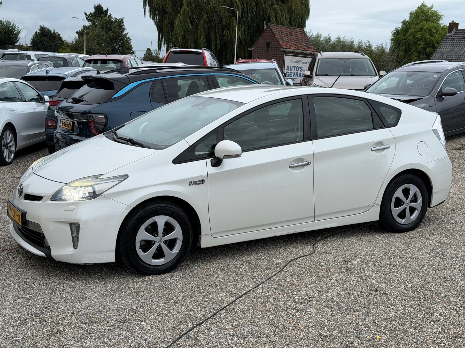 Toyota Prius 1.8 Plug-in Dynamic Business 2e Eig Oplaadbaar, Auto's, Euro 5, Gebruikt, Zwart, Wit