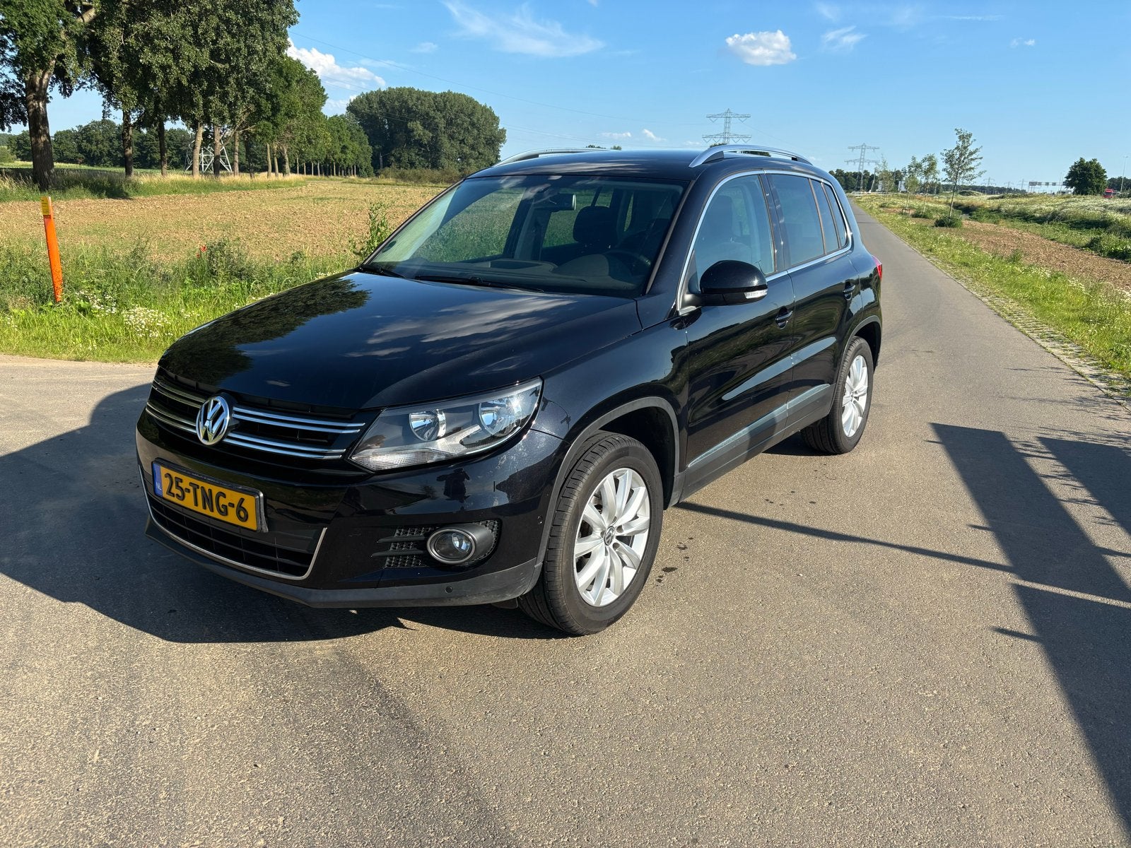 Volkswagen Tiguan 1.4 TSI 90KW BMT 2012 Zwart, Auto's, Voorwielaandrijving, 15 km/l, 4 cilinders, Origineel Nederlands