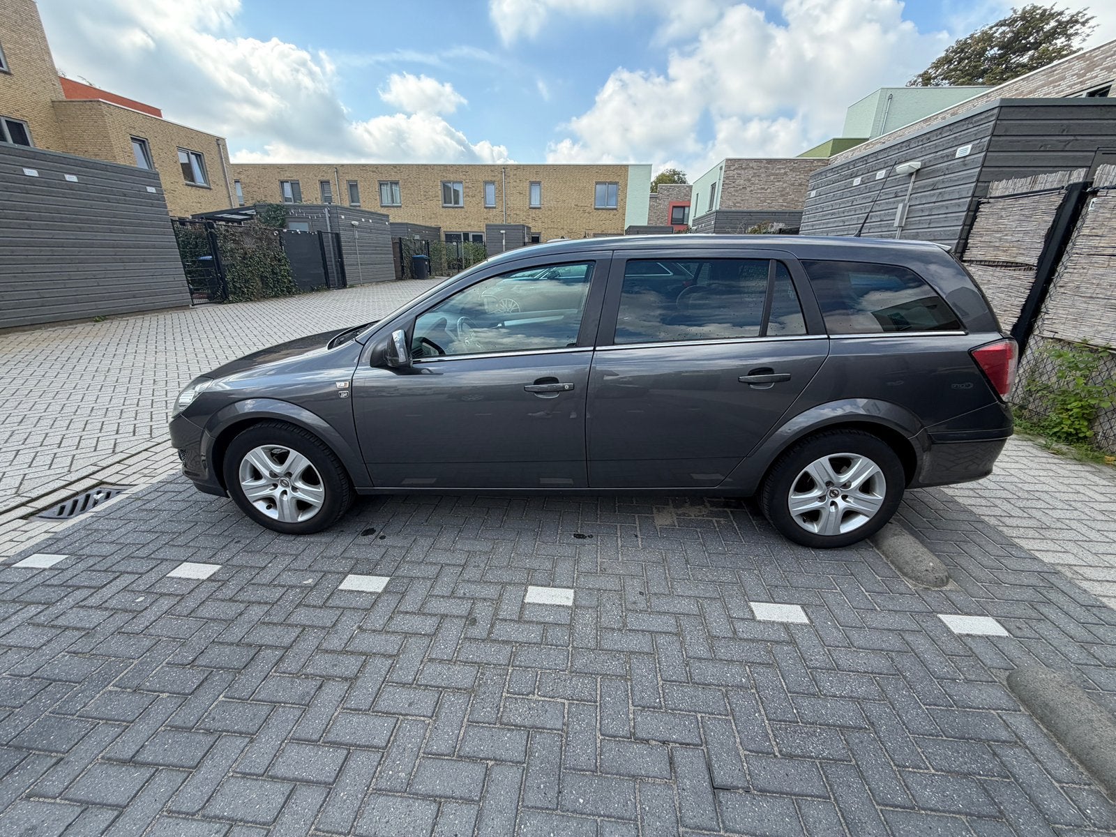 Opel Astra 1.6 16V 85KW St.wgn. 2010 Grijs, Auto's, Voorwielaandrijving, 15 km/l, Stationwagon, 115 pk