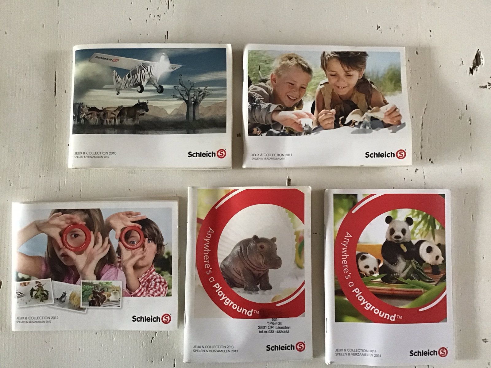 Schleich catalogi boekjes 2010-2014, Ophalen of Verzenden, Gelezen