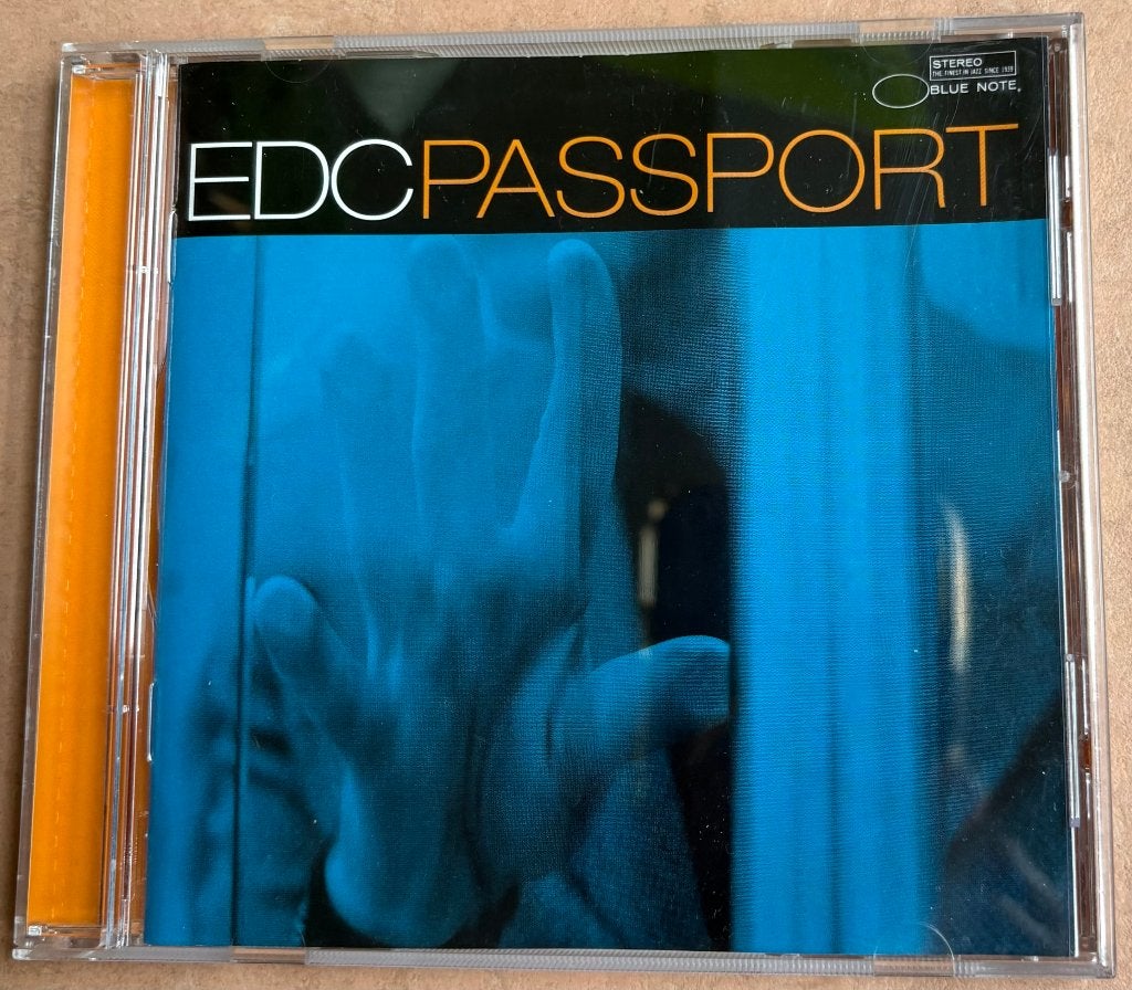EDC (Eddy De Clercq) - 'Passport', Gebruikt, Ambiënt of Lounge, Ophalen of Verzenden, Inclusief boekje
