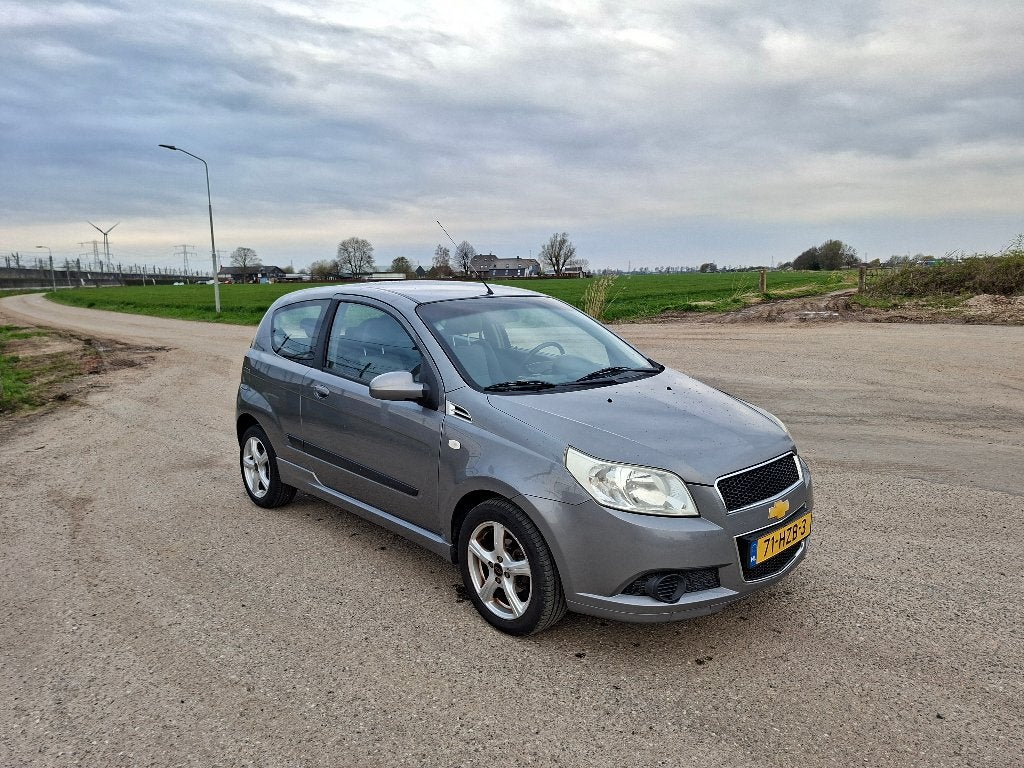 Chevrolet Aveo 1.2 16V 3D 2009 Grijs Airco, Voorwielaandrijving, Stof, 40 €/maand, Aveo
