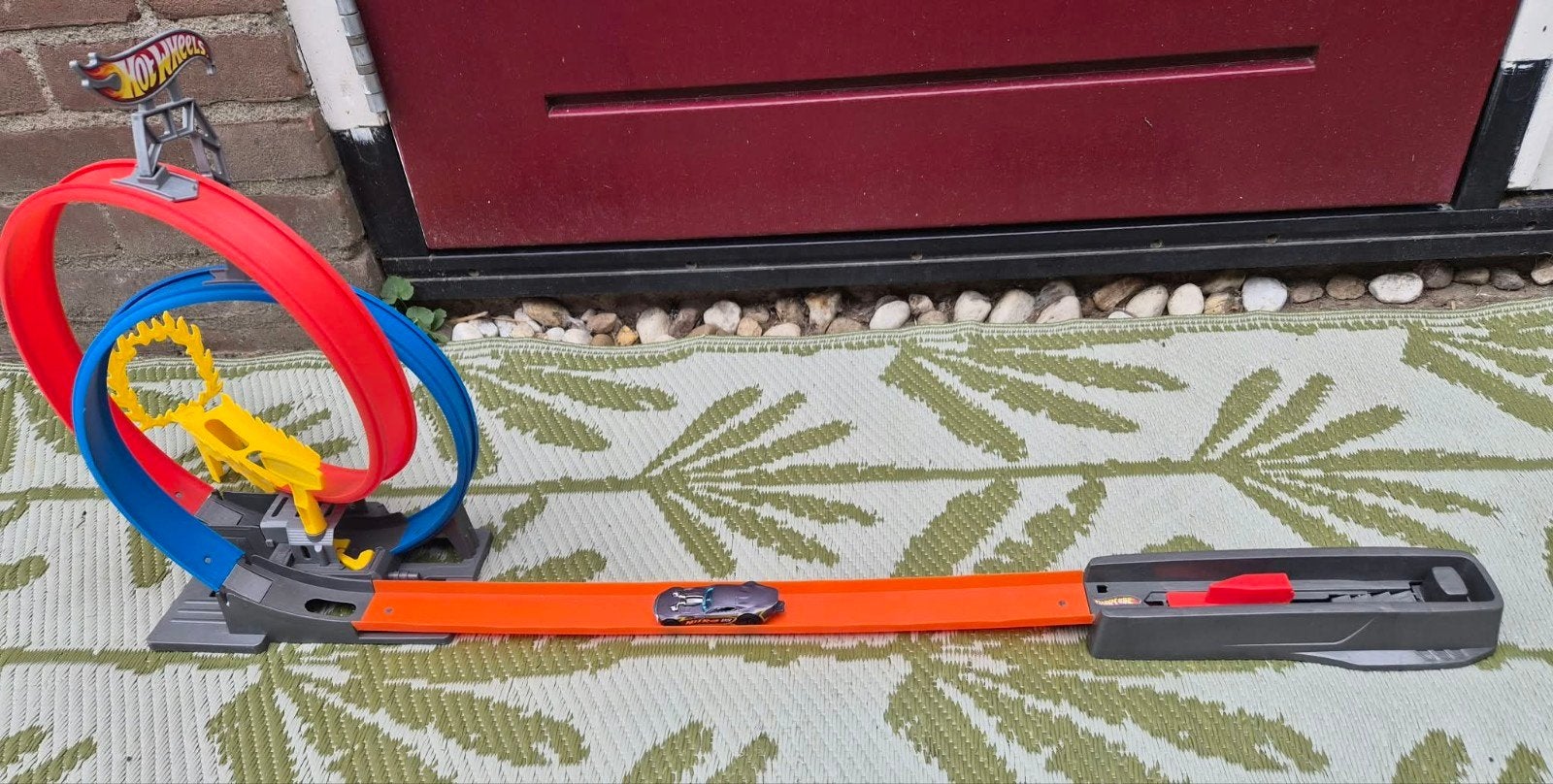 Hot Wheels racebaan met dubbele looping & auto, Kinderen en Baby's, Racebaan, Ophalen of Verzenden, Zo goed als nieuw, Hot Wheels