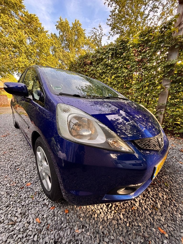 Honda Jazz 1.4 automaat 2009 blauw metallic -luxe uitvoering, Auto's, Dealer onderhouden, 450 kg, Winterpakket, 4 cilinders