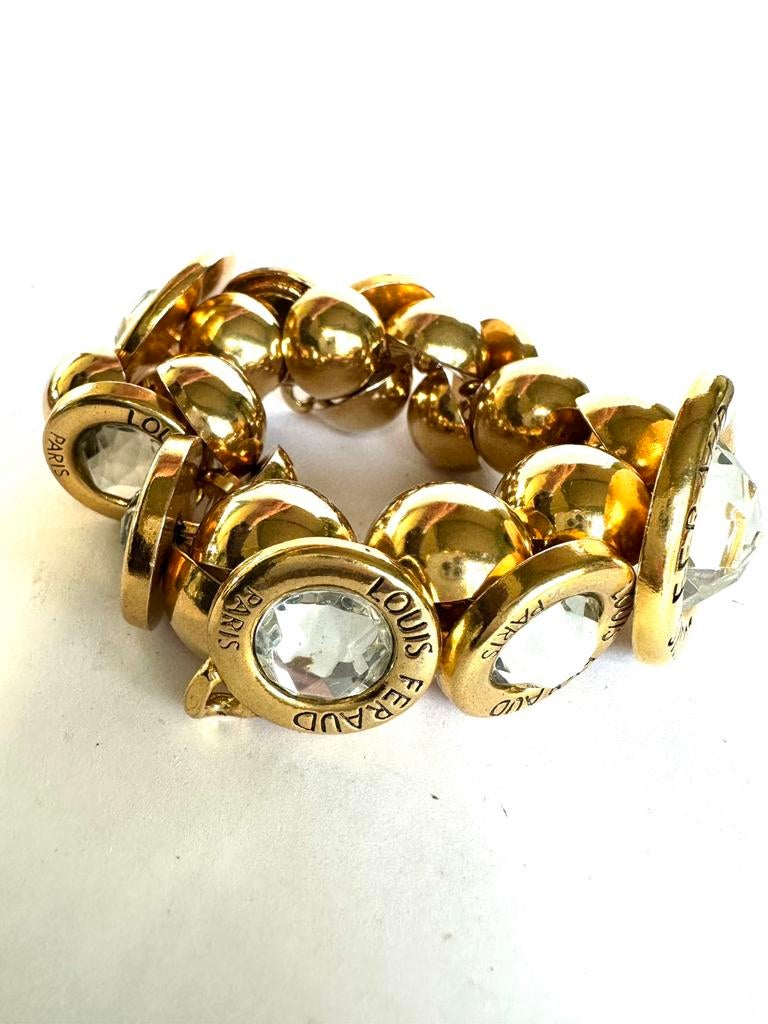 Louis Feraud Paris knopen stretch armband, Verzenden, Zo goed als nieuw, Goud, Overige materialen