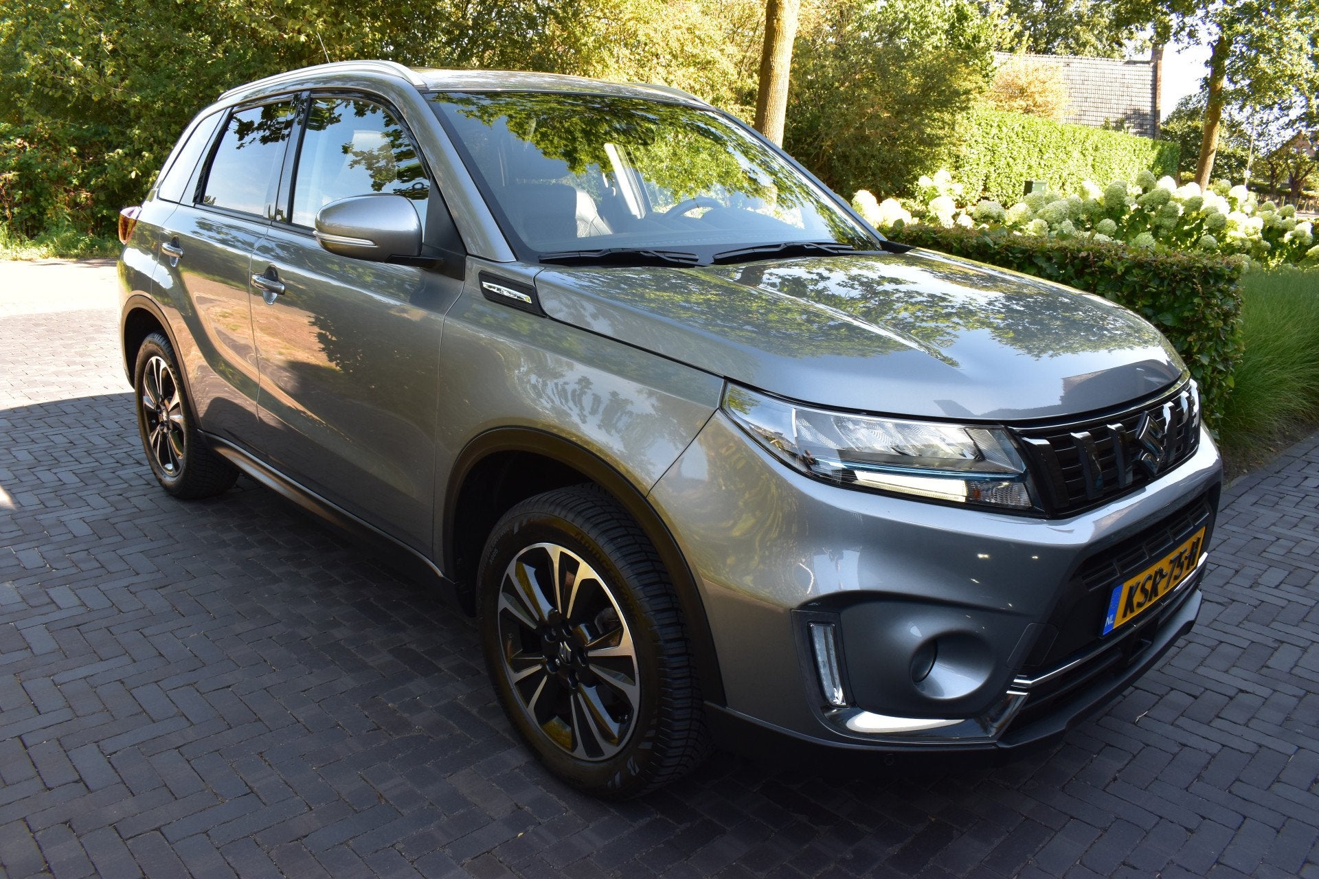 Suzuki Vitara 1.4 Boosterjet Style Hybrid Pano Leer NIEUWST!, Dealer onderhouden, Gebruikt, 4 cilinders, Leder en Stof