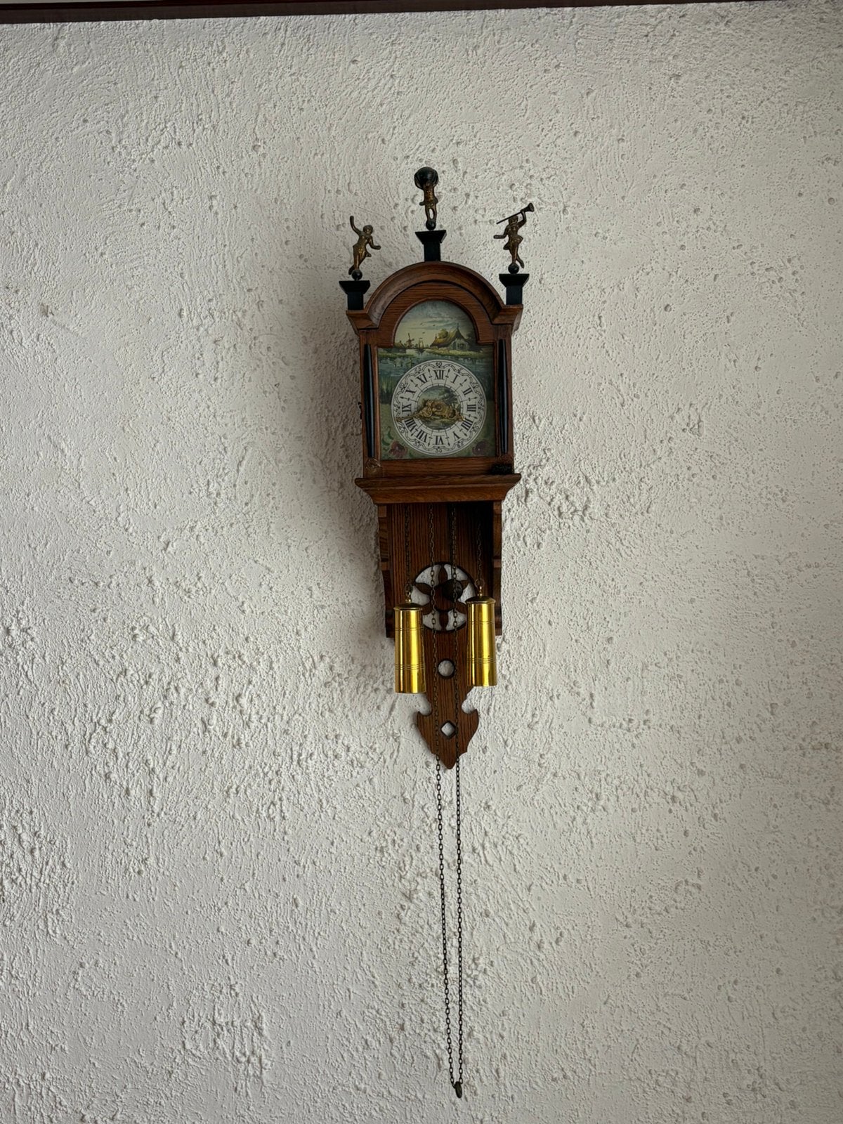 Wand klok met slinger, Ophalen