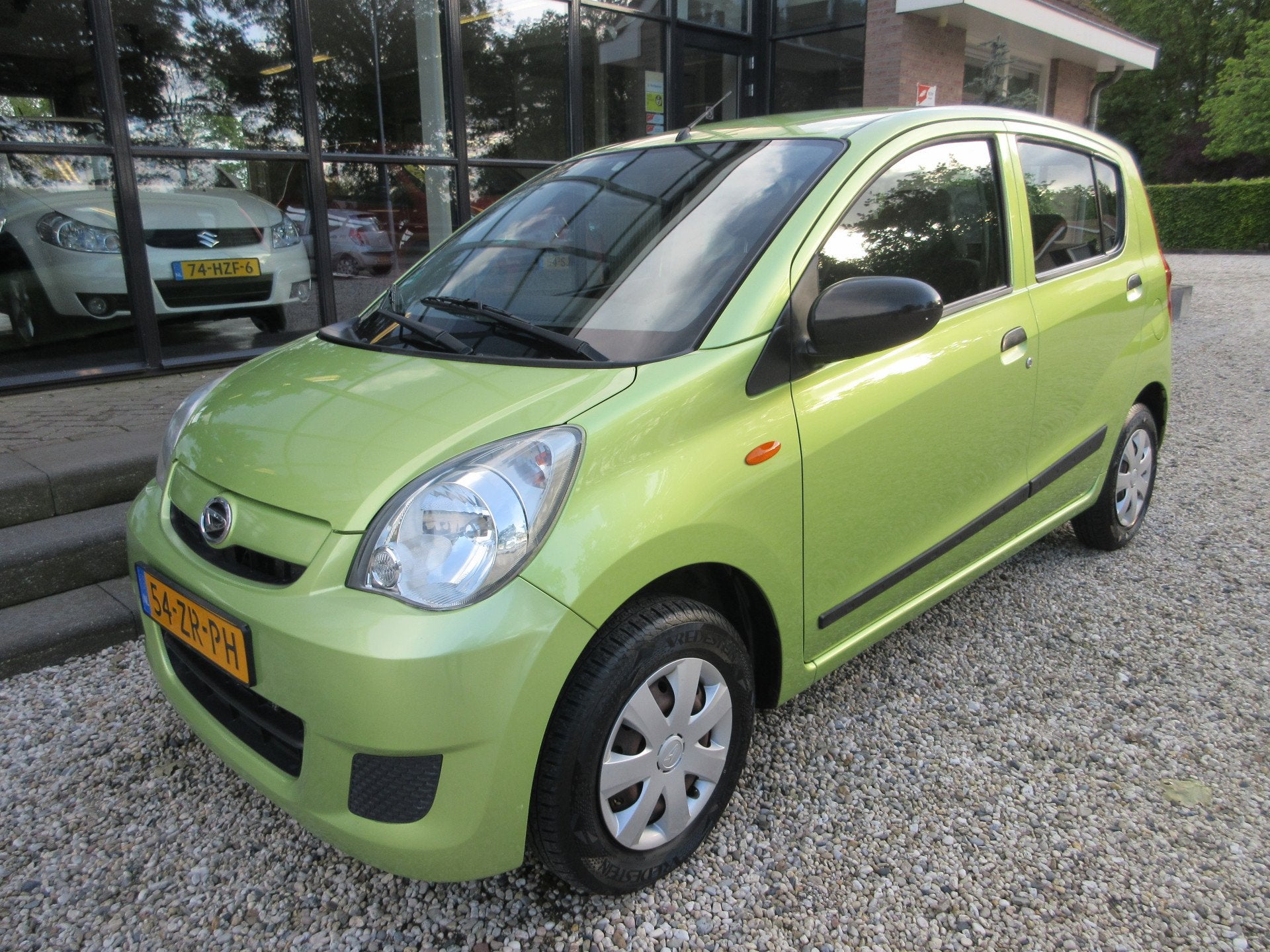 Daihatsu Cuore 1.0 navigatie (bj 2008), Auto's, Voorwielaandrijving, Stof, Zwart, 18 €/maand
