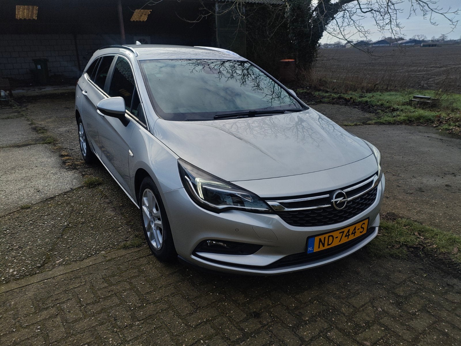 Opel Astra 1.4 Turbo 110KW Sports Tourer automaat 2017 Grijs, Auto's, Opel, Origineel Nederlands, Stationwagon, 19 km/l, Particulier
