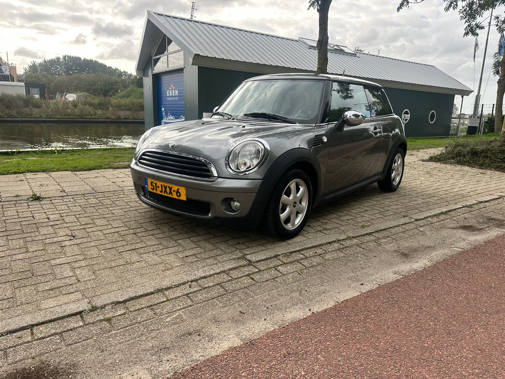 Mini 1.4 16V ONE 2009 Grijs, Auto's, Voorwielaandrijving, Stof, Zwart, 4 cilinders