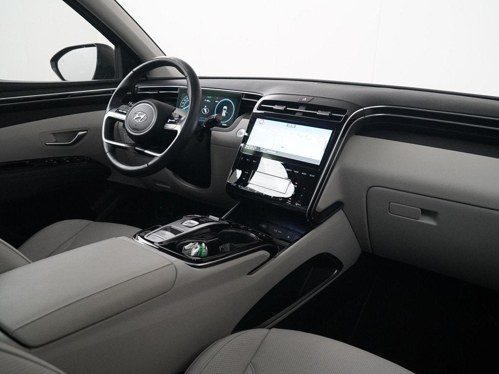 Hyundai Tucson 1.6 T-GDI PHEV Premium Sky 4WD | Panoramadak, Auto's, Hyundai, 14 kWh, Gebruikt, 4 cilinders, Zwart