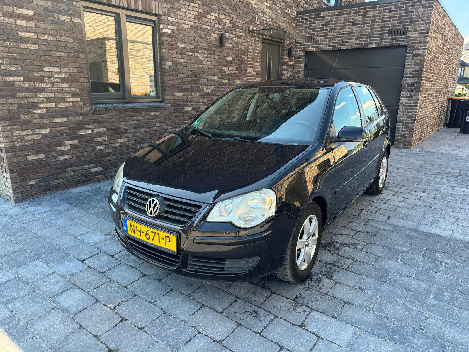 Volkswagen Polo 1.2 47KW 2007 Zwart, Auto's, Voorwielaandrijving, Stof, 540 kg, 1198 cc