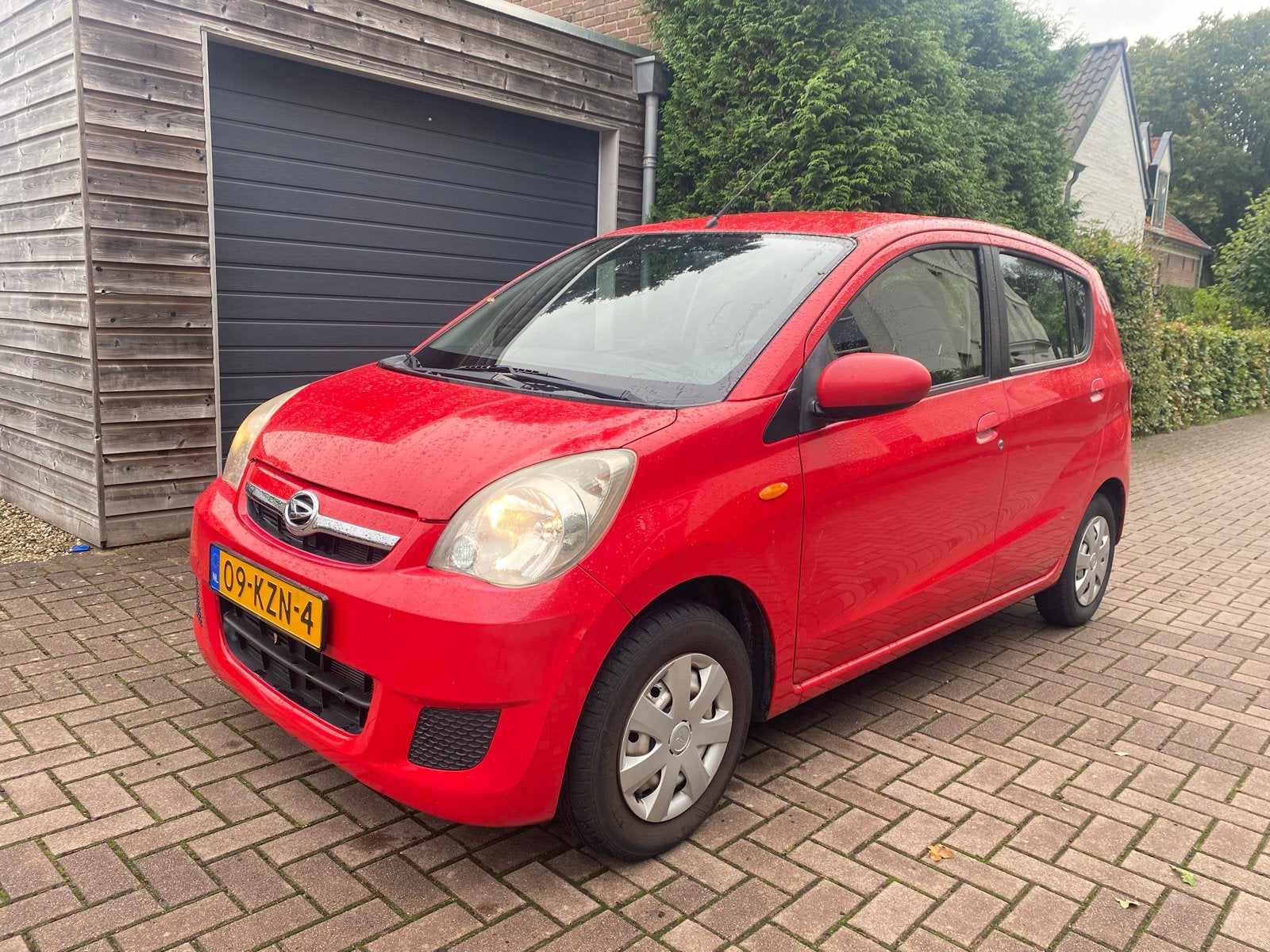 Daihatsu Cuore 1.0 5D 2010 Rood, Auto's, Voorwielaandrijving, 600 kg, 18 €/maand, 4 stoelen