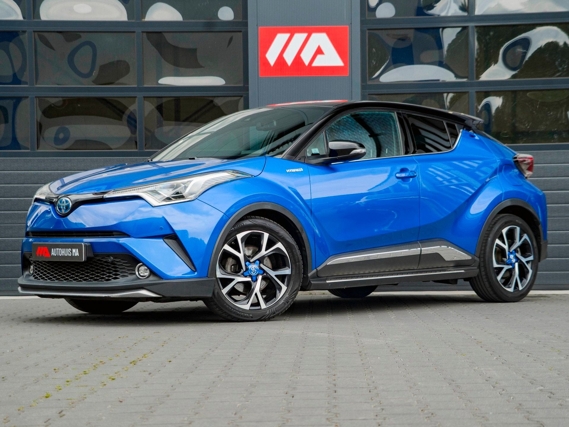 Toyota C-HR 1.8 Hybrid Bi-Tone | CAMERA | JBL | STOELVERWARM, Auto's, Toyota, Euro 6, 4 cilinders, Met garantie (alle), Blauw