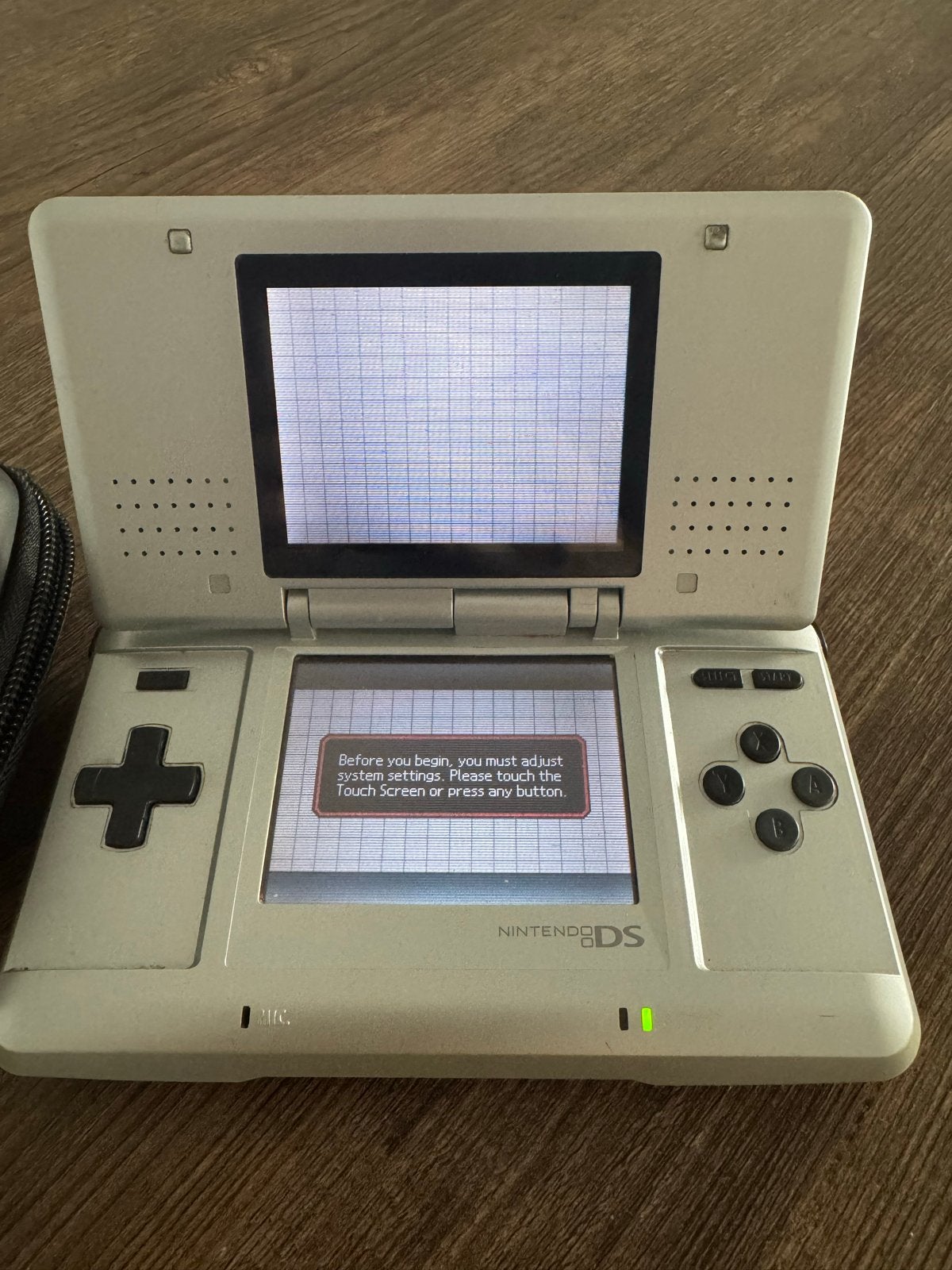Nintendo DS Lite met 4 spellen en accessoires, Met games, Ophalen of Verzenden, Zo goed als nieuw, Zilver