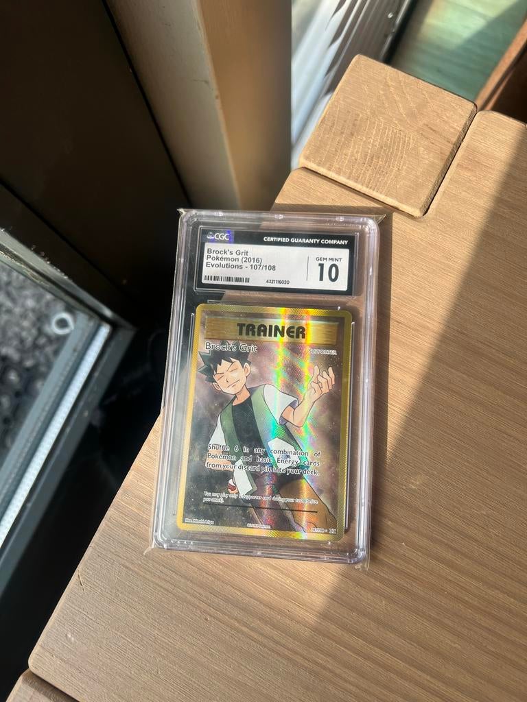 Brock's Grit (2016) Evolutions - CGC 10 Gem Mint, Ophalen of Verzenden, Zo goed als nieuw, Losse kaart, Foil