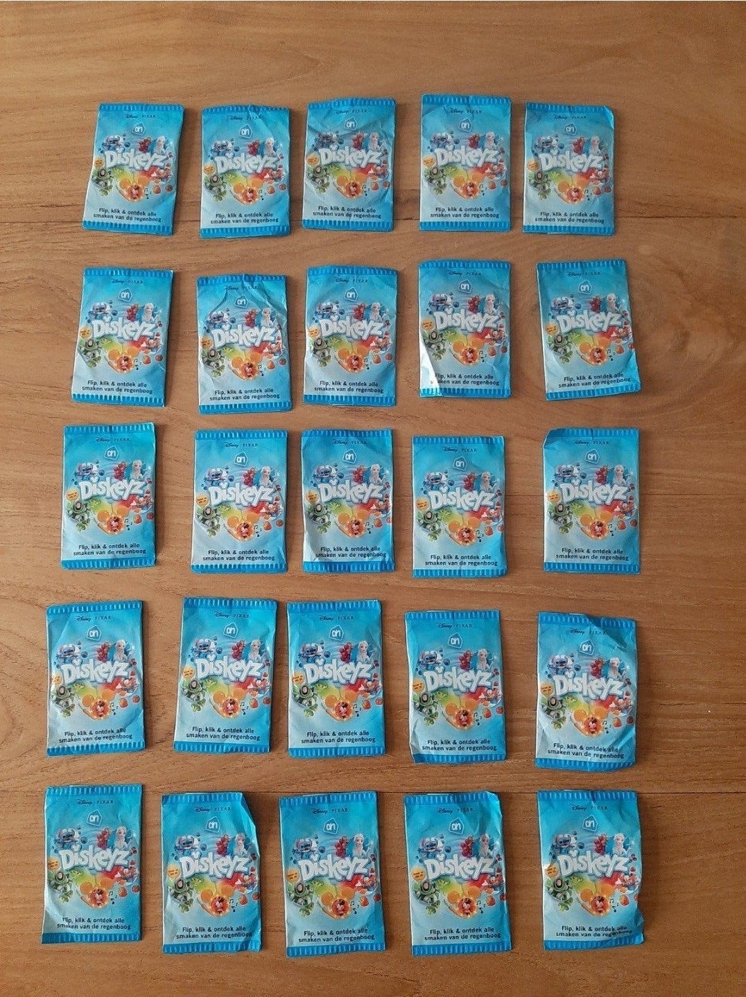 25 x nieuwe en ongeopende AH Disney Pixar Diskeyz, Verzamelen, Albert Heijn, Ophalen of Verzenden