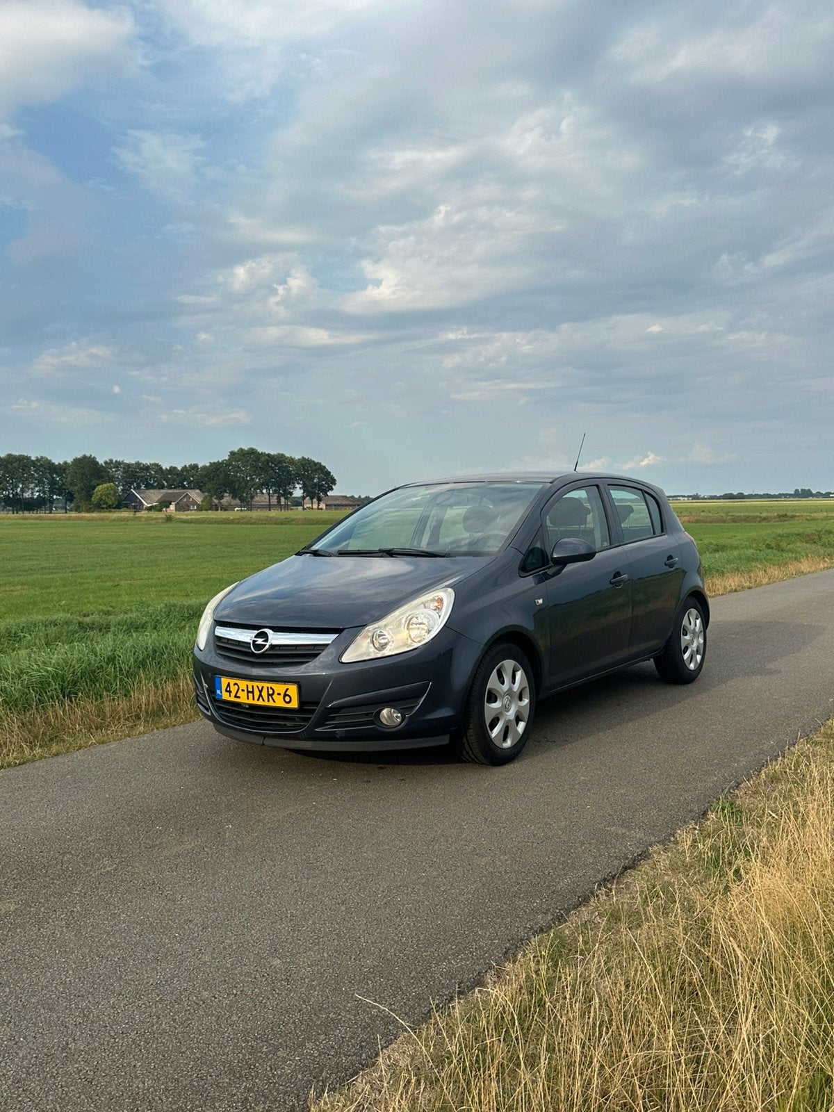 Opel Corsa 1.2 16V 5D 2009 Grijs Airco!, Voorwielaandrijving, Sound system, Stof, Zwart