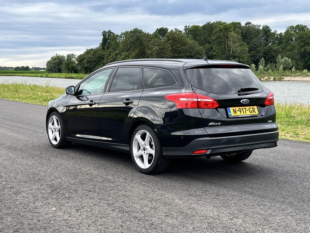 Ford Focus Wagon 1.0 Titanium Edition Clima, cruise, stoel-s, Gebruikt, Euro 6, Automatische klimaatregeling, Zwart