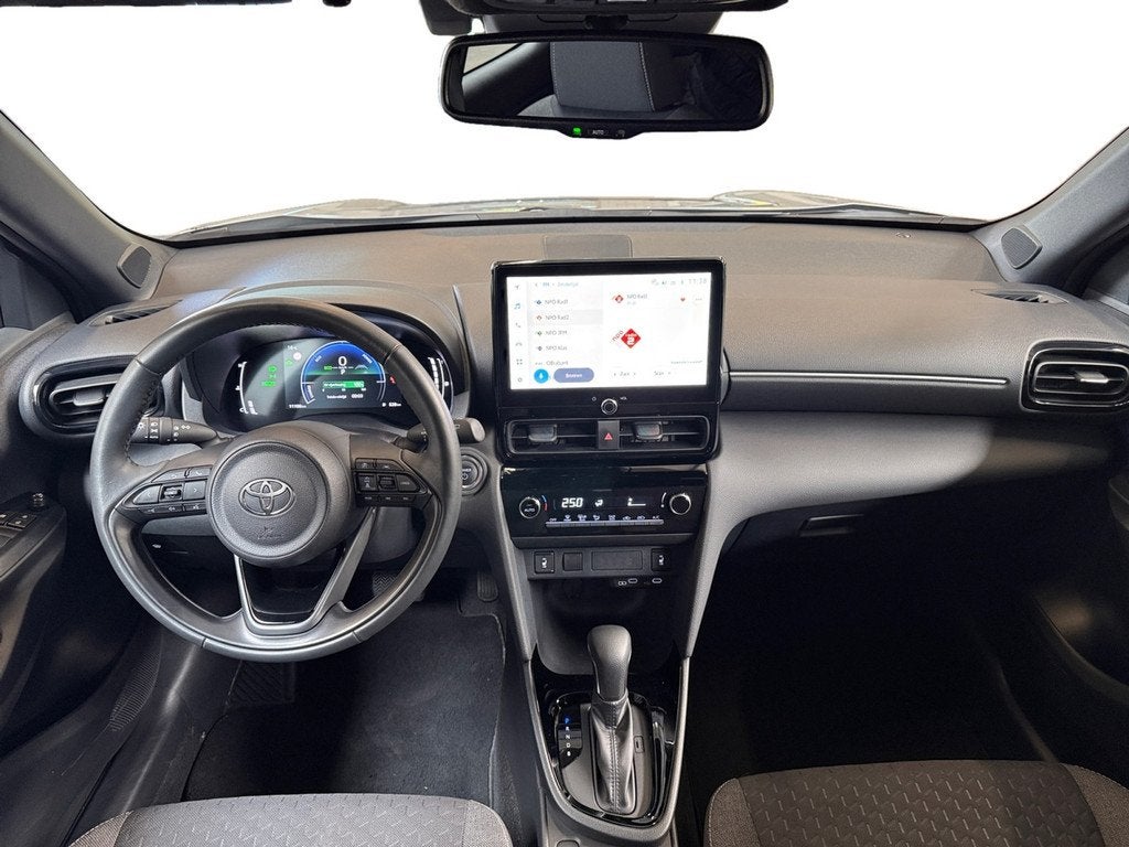 Toyota Yaris Cross 1.5 Hybrid 115 Dynamic I Stuur en Stoelve, Auto's, Toyota, Stof, Gebruikt, 4 cilinders, 1165 kg