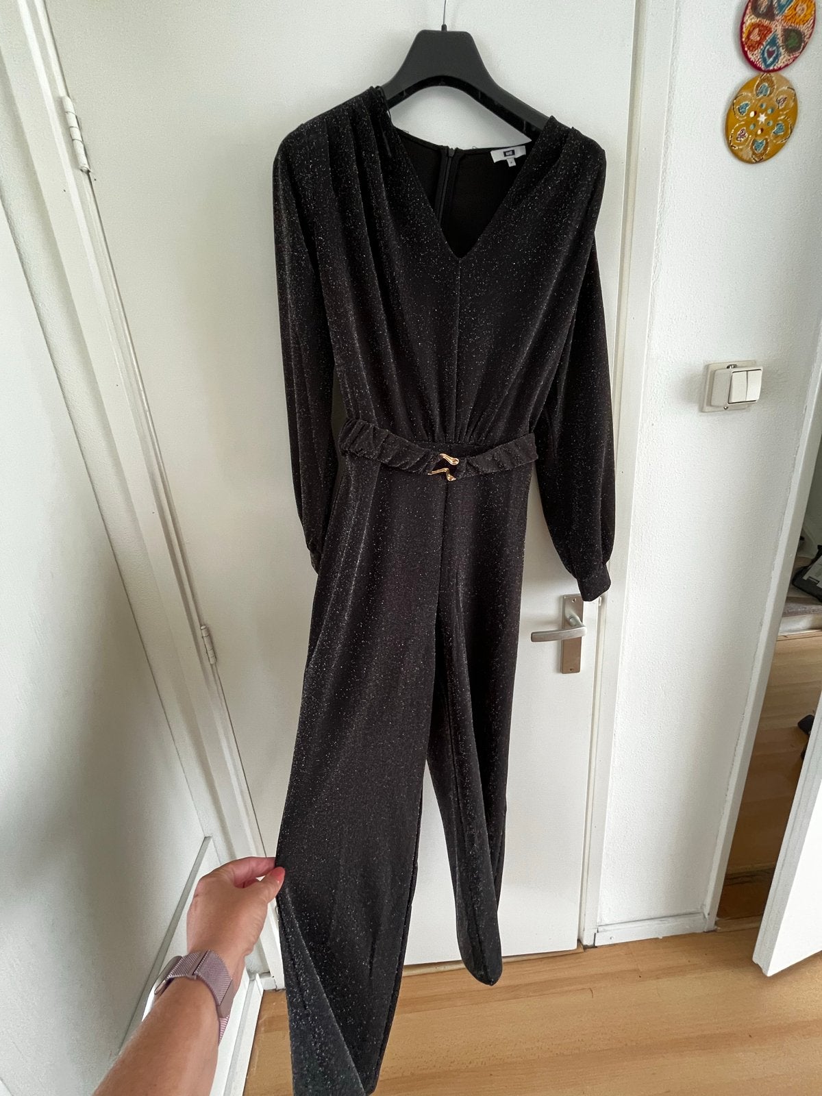 WE Zwarte Glitter Jumpsuit Maat M, Ophalen of Verzenden, Zo goed als nieuw, Maat 38/40 (M), Zwart