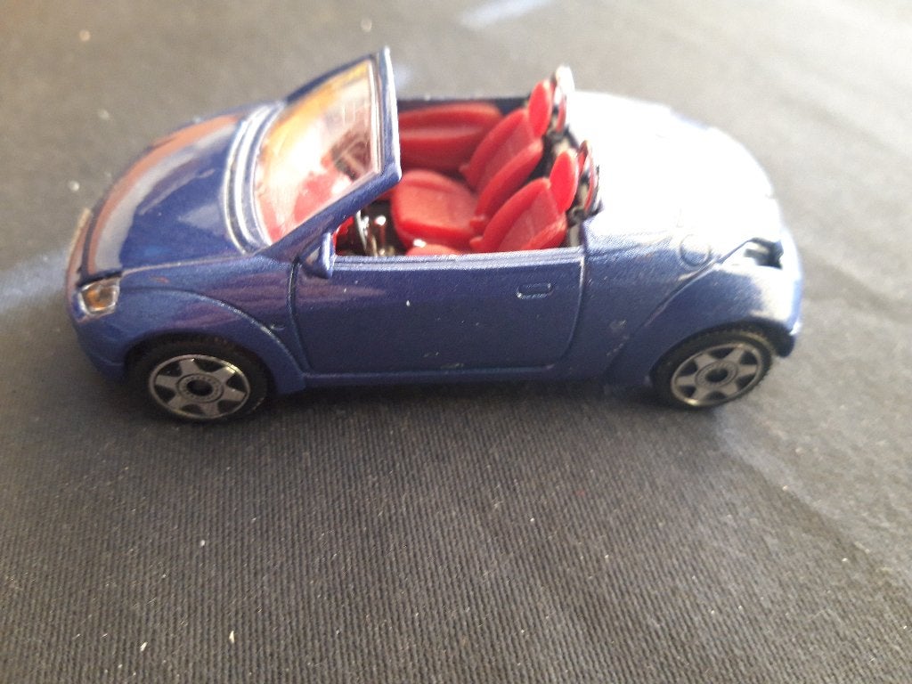 Ford Streetka blauw metallic 1:43, Hobby en Vrije tijd, Modelauto's | 1:43, Ophalen of Verzenden, Zo goed als nieuw, Auto, Overige merken