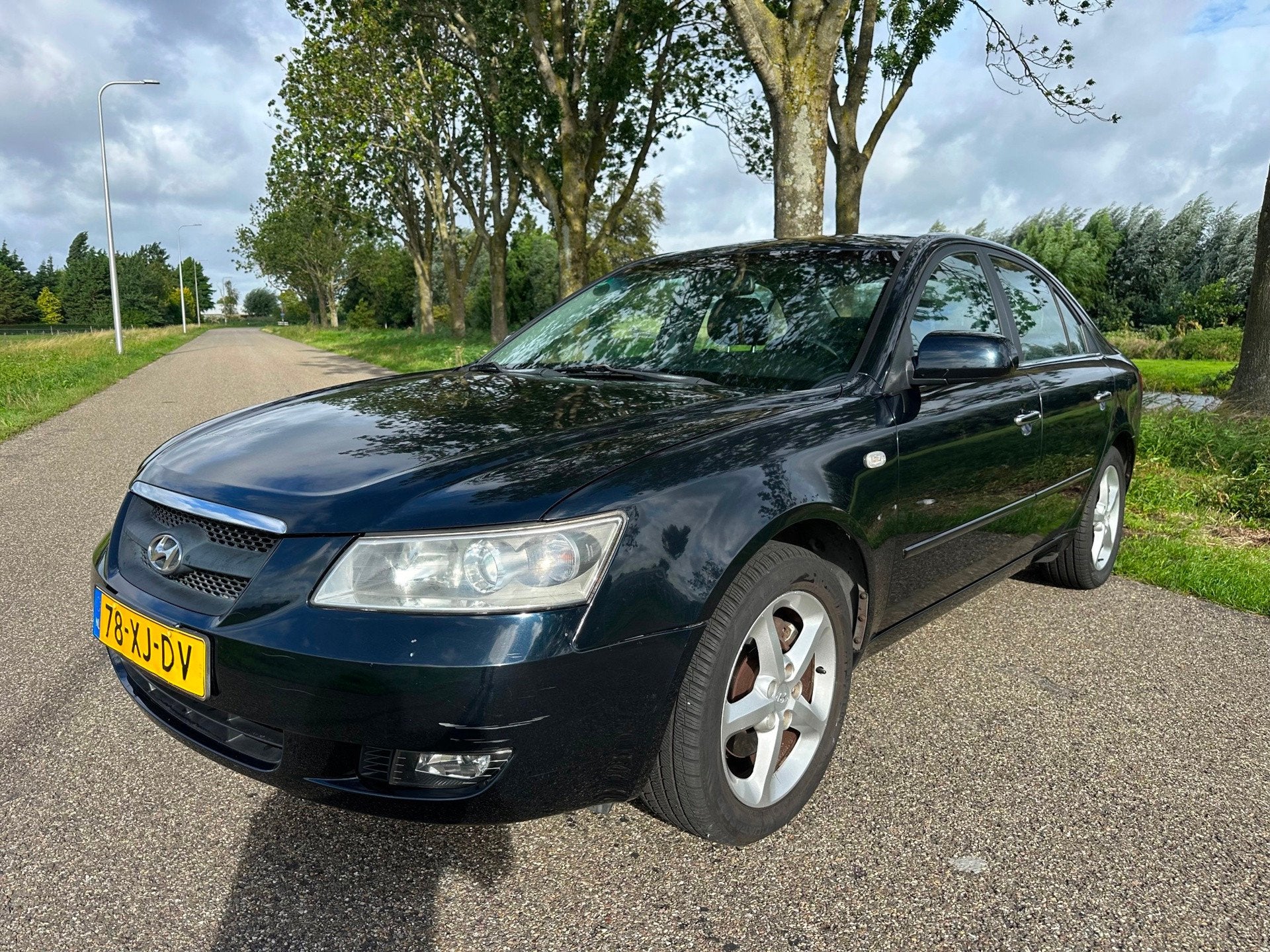 Hyundai Sonata 3.3 V6 Style|leder|automaat|clima|rijdt super, Auto's, Gebruikt, Zwart, Verwarmde buitenspiegels, Blauw