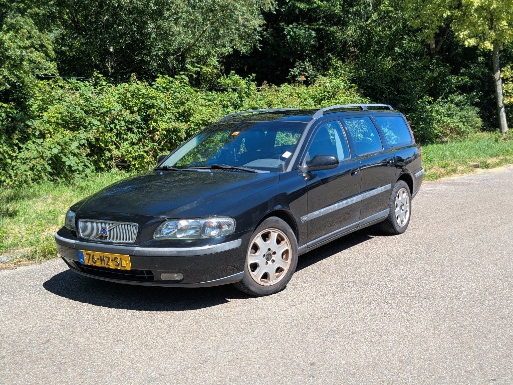 Volvo V70 2.4 140PK 2002 Zwart, Auto's, Volvo, Voorwielaandrijving, Stof, 1800 kg, Zwart