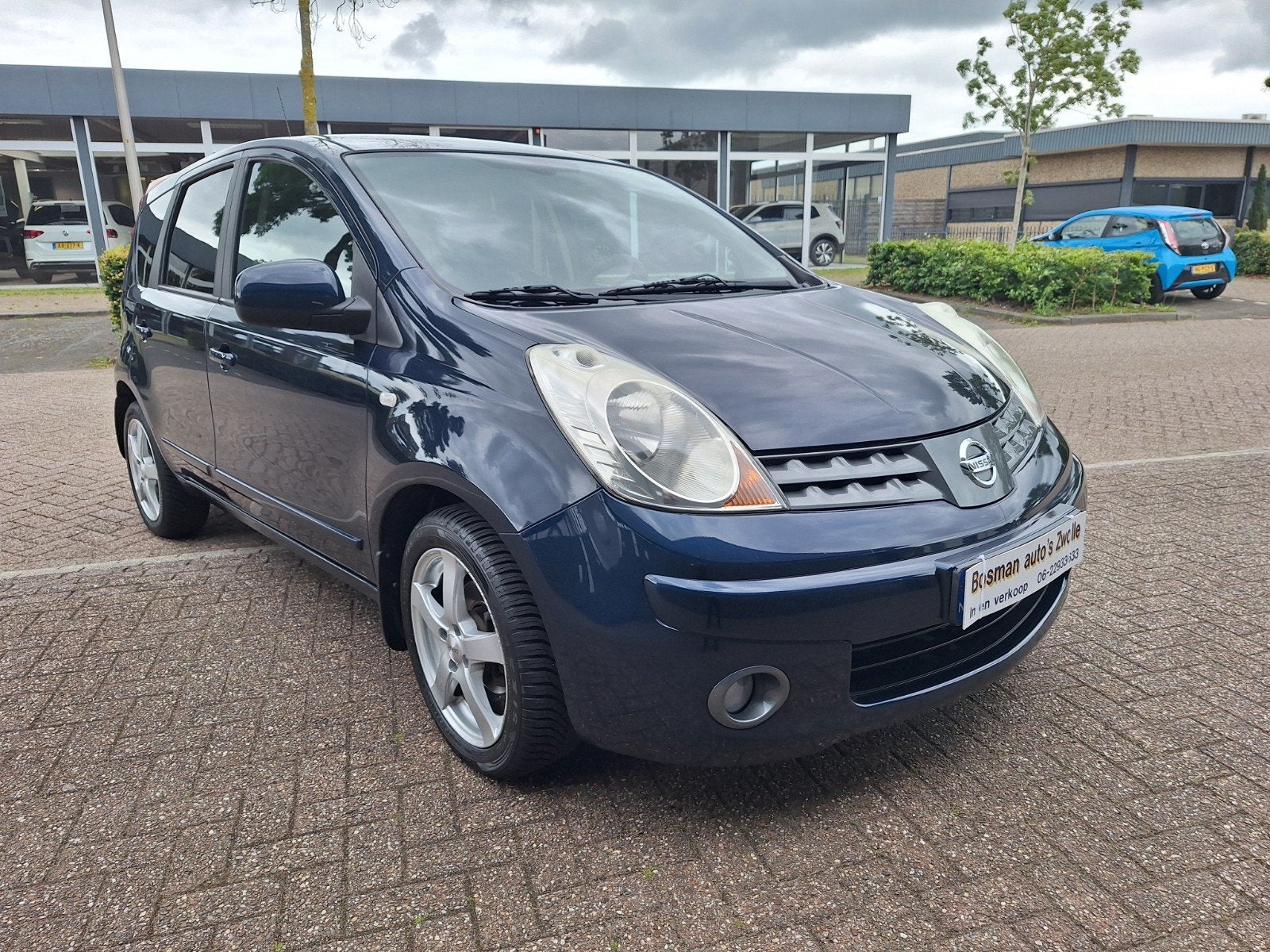 Nissan Note 1.4 16V 2009 mooie en goede Auto Airco Steenkou, Voorwielaandrijving, Stof, Elektrische ramen, Zwart