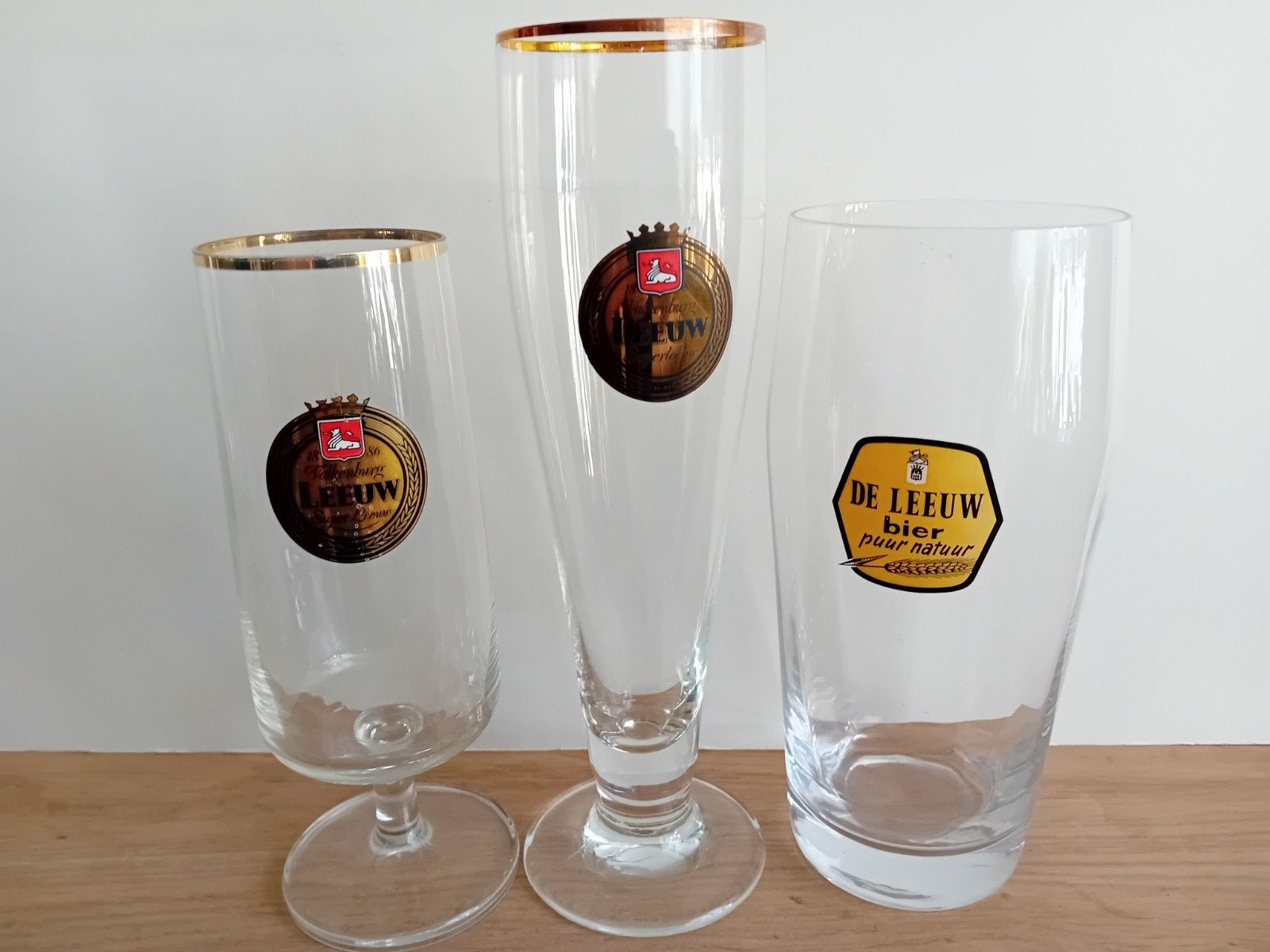 12 Leeuw bierglazen, Ophalen of Verzenden, Zo goed als nieuw, Glas of Glazen